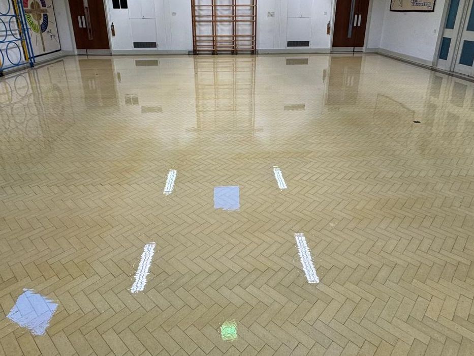 Herringbone Granwood block floor in a hall with a glossy finish after sanding and sealing