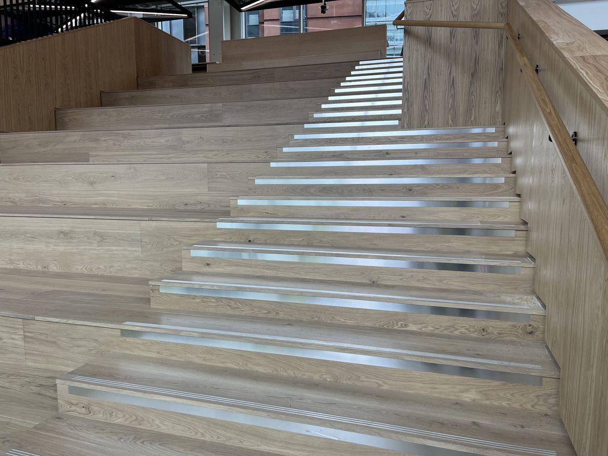Flight of oak hardwood stairs with aluminium nosings on each step